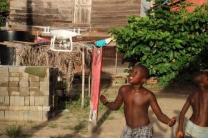 Maroon kid with a drone